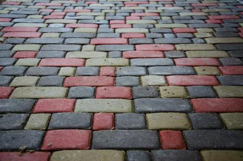 Abstract background. Old cobblestone pavement close-up. City Stock Photos