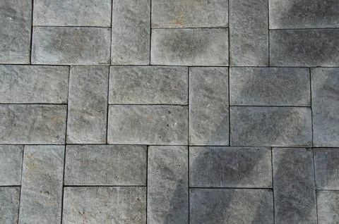 Abstract background. Old cobblestone pavement close-up. City Stock Photos
