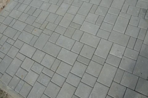 Abstract background. Old cobblestone pavement close-up. City Stock Photos