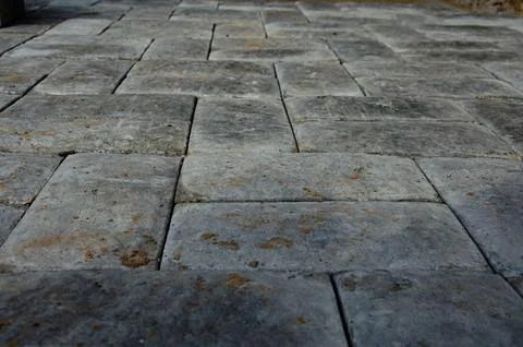 Abstract background. Old cobblestone pavement close-up. City Stock Photos