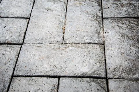 Abstract background. Old cobblestone pavement close-up. City Stock Photos