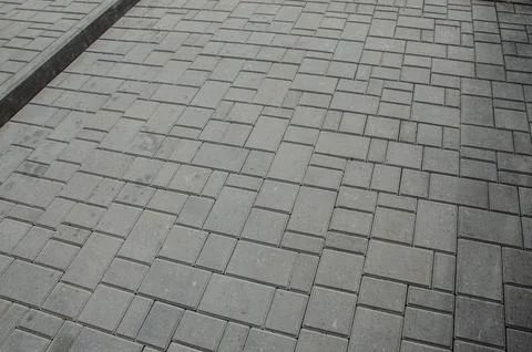 Abstract background. Old cobblestone pavement close-up. City Stock Photos