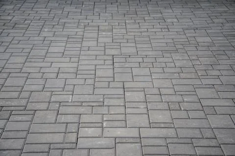 Abstract background. Old cobblestone pavement close-up. City Stock Photos