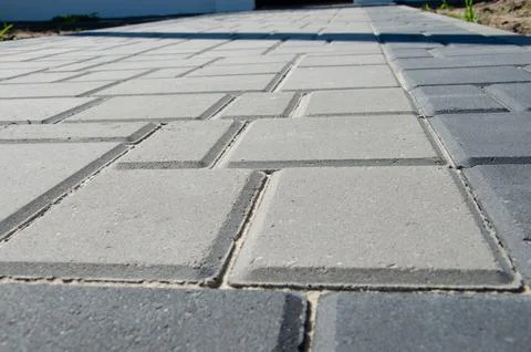 Abstract background. Old cobblestone pavement close-up. City Stock Photos
