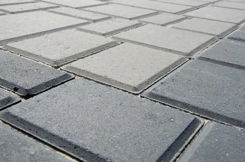 Abstract background. Old cobblestone pavement close-up. City Stock Photos