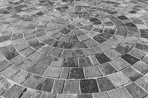 Abstract background of old cobblestone pavement close up. Stock Photos