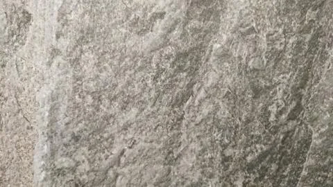 The abstract background of a old gray wall. Selective focus. Stock Photos