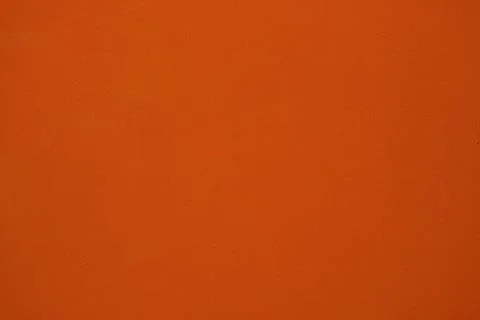 Abstract background of old orange paint on the wall. Stock Photos