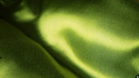 Abstract background of olive green silk fabric waving in the wind. Textile. Stock Footage 333003148