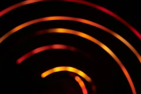 Abstract background orange blurred light lines on dark background Stock Photos