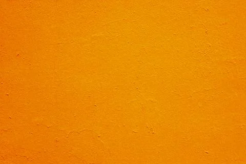 Abstract background of orange plaster on the wall. Stock Photos