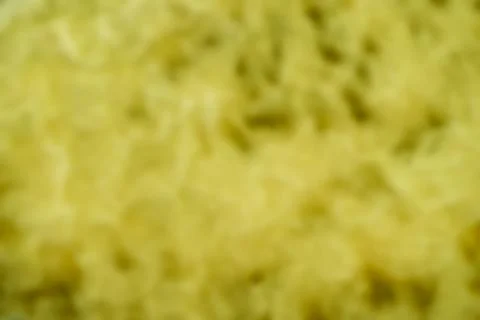 An abstract background out of focus of a yellow color Illustrazione stock