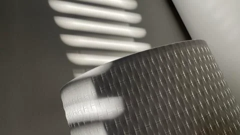 Abstract background pattern of light through Venetian blinds falling on textured Stock Photos