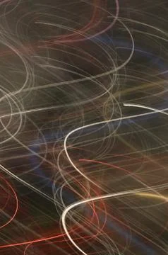 Abstract background pattern of red white and blue light trails and swirls Stock Photos