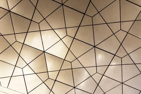 Abstract background pattern of silver and gold triangles. Stock Photos