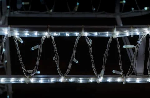 Abstract background pattern small lamps on a black background close up Stock Photos