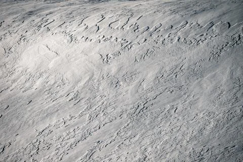 Abstract background of patterns formed by the wind on the snow Stock Photos