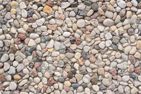 Abstract background paving consisting of small pebbles embedded in cement Stock Photos