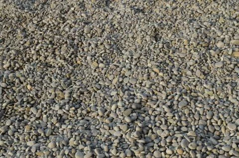 Abstract background with pebbles-grey round sea stones Stock Photos