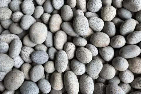 Abstract background from pebbles pattern on the beach. Natural and environmen Stock Photos