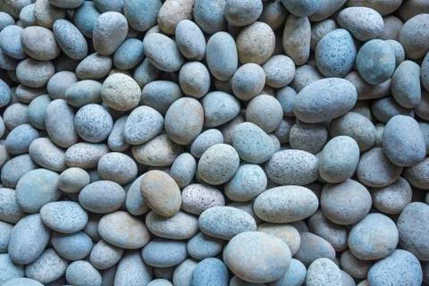 Abstract background from pebbles pattern on the beach. Natural and environmen Stock Photos