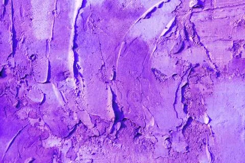 Abstract background plaster on the wall, painted in ultraviolet color. Stock Photos