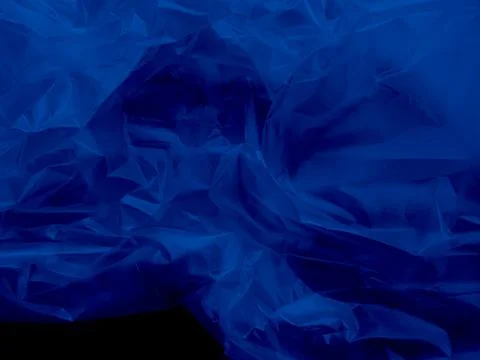 Abstract background plastic bag blue vacuum cling foil wrinkle texture Foto stock