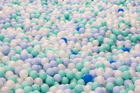 Abstract background from plastic balls of white, blue and green colors. Pool  Stock Photos