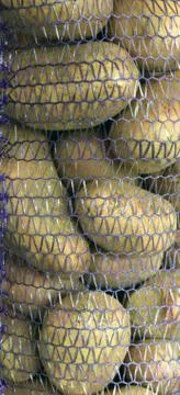 Abstract background. Potatoes in packing. Stock Photos