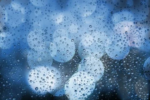 Abstract background with raindrops and soft blue bokeh. Defocused lights and Stock Illustration