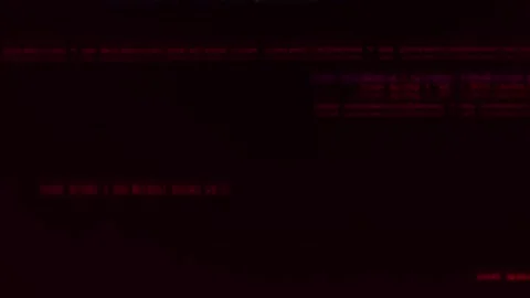 Abstract background of red blurred lines of program code on a black background Stock Footage 315012917