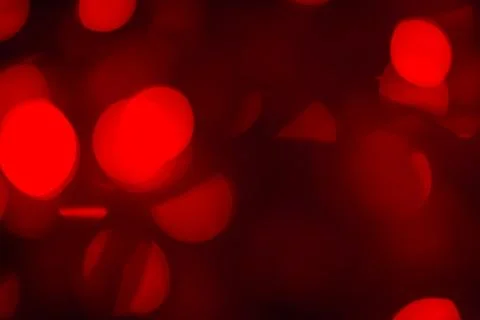 Abstract background red bokeh circles. Beautiful background with particles. T Foto stock