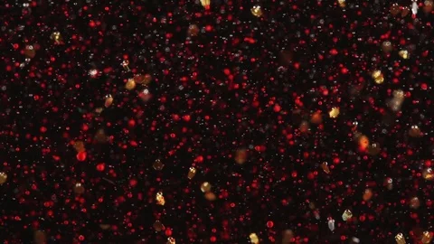 Abstract Background Red Droplets and Gold Flakes Float on Black Stock Footage 71121471