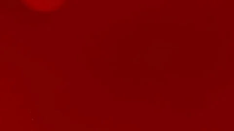 Abstract background. Red ink reacting in water creating abstract background. Видео 89811832