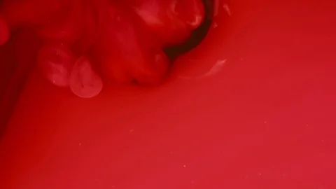 Abstract background. Red ink reacting in water creating abstract background. Stock Footage 89811938