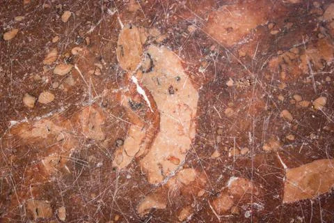 Abstract background red marble floor all covered with scratches. Stock Photos