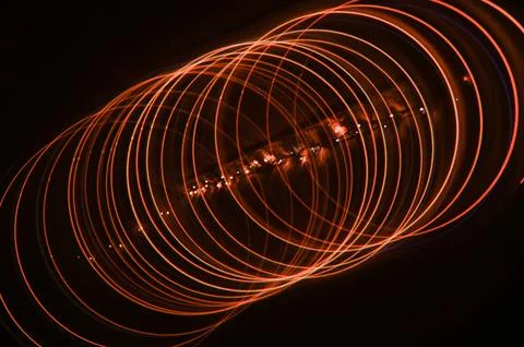 Abstract background of red spirals of lines of circles. 스톡 사진