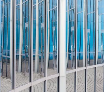Abstract background reflected in the glass windows of the building Stock Photos
