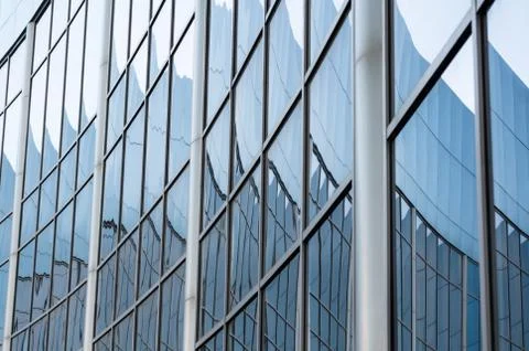 Abstract background reflected in the glass windows of the building Stock Photos