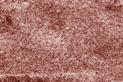 Abstract background from a relief surface of a stone close-up of red color. Stock Photos