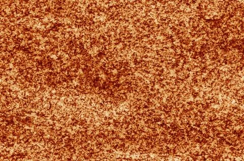 Abstract background from a relief surface of a stone close-up. Stock Photos