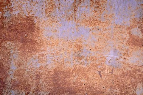 Abstract background of the rusted metal. Grunge old iron panel. Stock Photos
