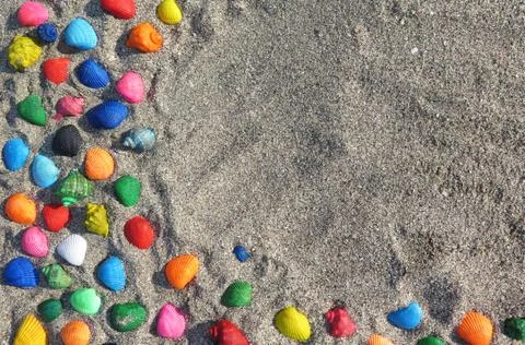 Abstract background with seashells in the sand Stock Photos