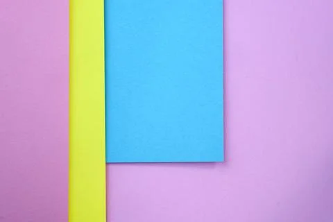 Abstract background from sheets of blue, pink and yellow paper. Foto stock