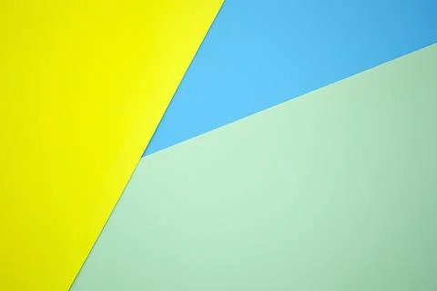 Abstract background from sheets of yellow, blue and green paper. Stock-Fotos