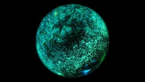 Abstract background shiny particles and objects outburst inside glass sphere Stock-Footage 250196481