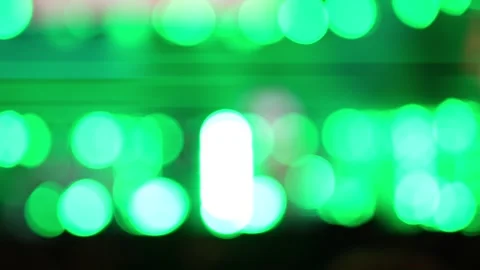 Abstract background showing blurred bright green bokeh spots with light. Stock Footage 344024857