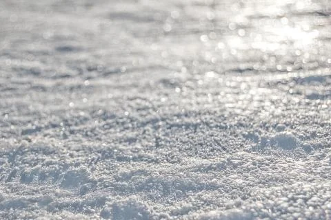 Abstract background showing snow texture glistering with sun rays Stock Photos