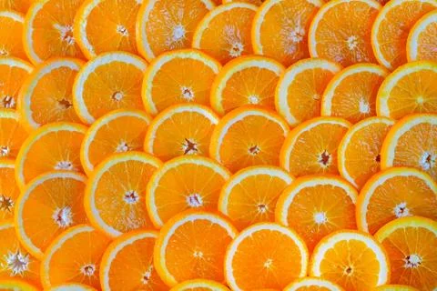 Abstract background of sliced oranges. Stock Photos