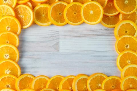 Abstract background of sliced oranges with rectangular copy space. Stock Photos